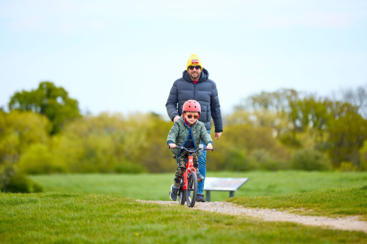 Man and boy on bicycle at Hadleigh Country Park