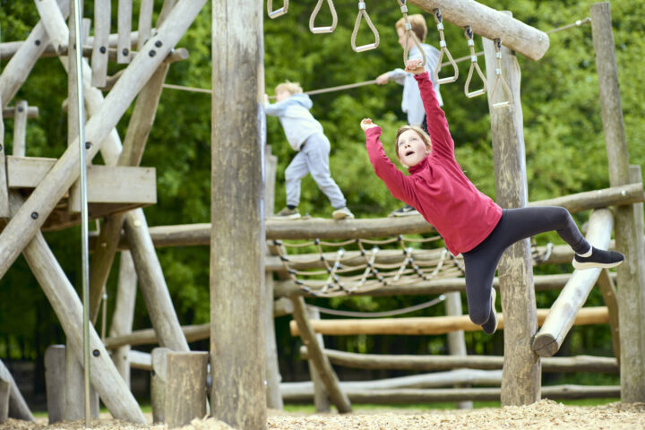 Boy on natural play equipment at Weald Country Park