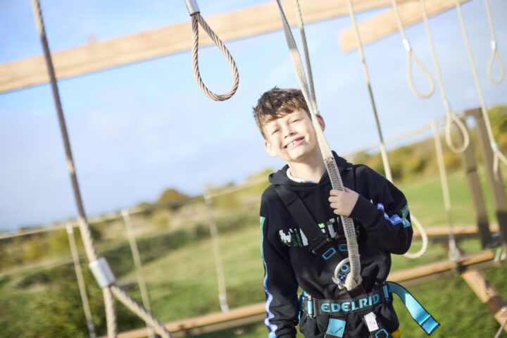 Boy on Sky Ropes course