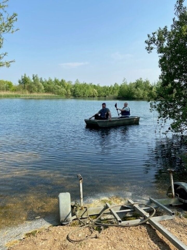 Park team putting out a tern raft at Hunts Hill Lake