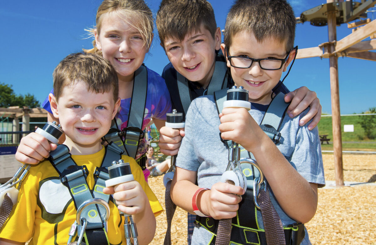 Young children in Sky Ropes harnesses