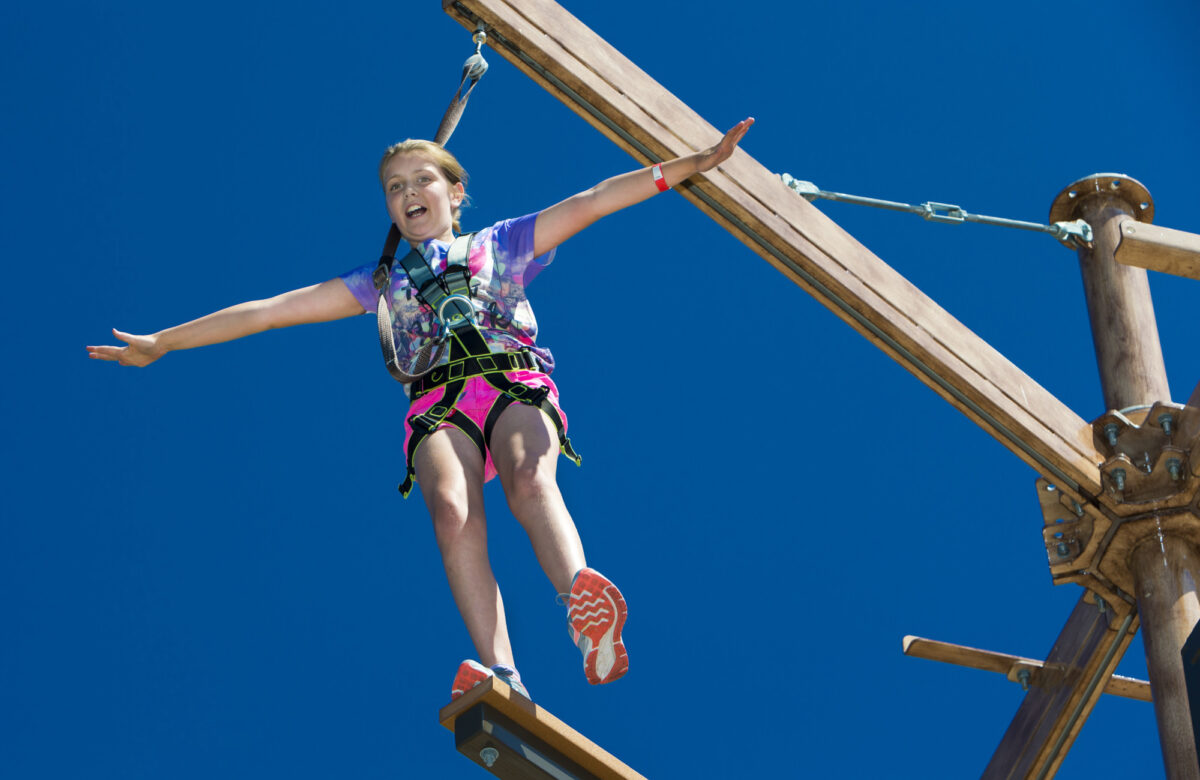A girl balancing at Sky Ropes