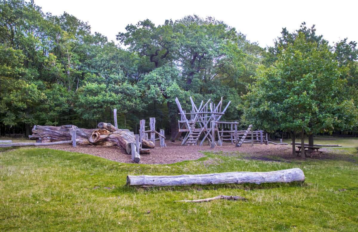 Apparatus at an outdoor adventure playground near a forest