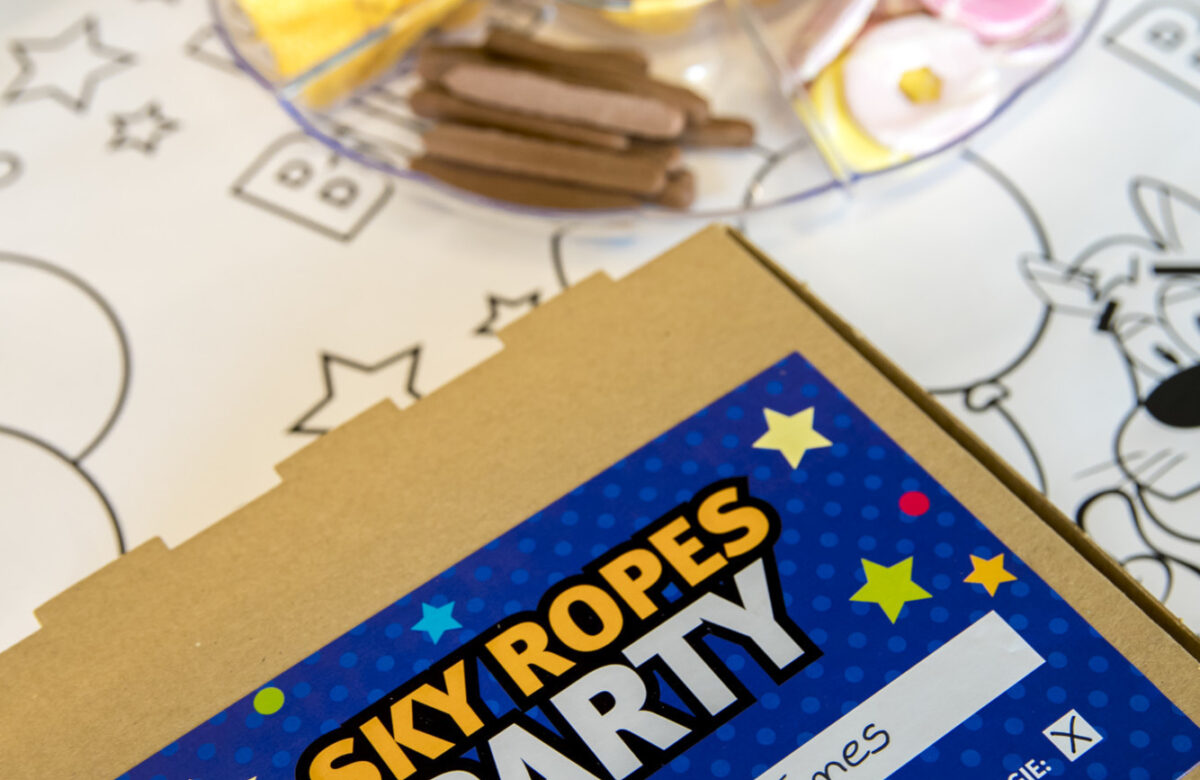 A Sky Ropes birthday party table setting