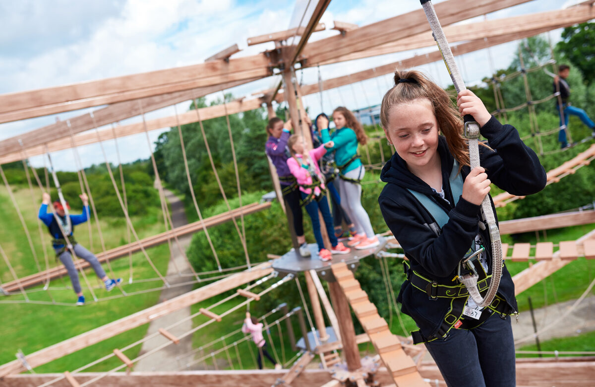 A group of people using the Sky Ropes apparatus