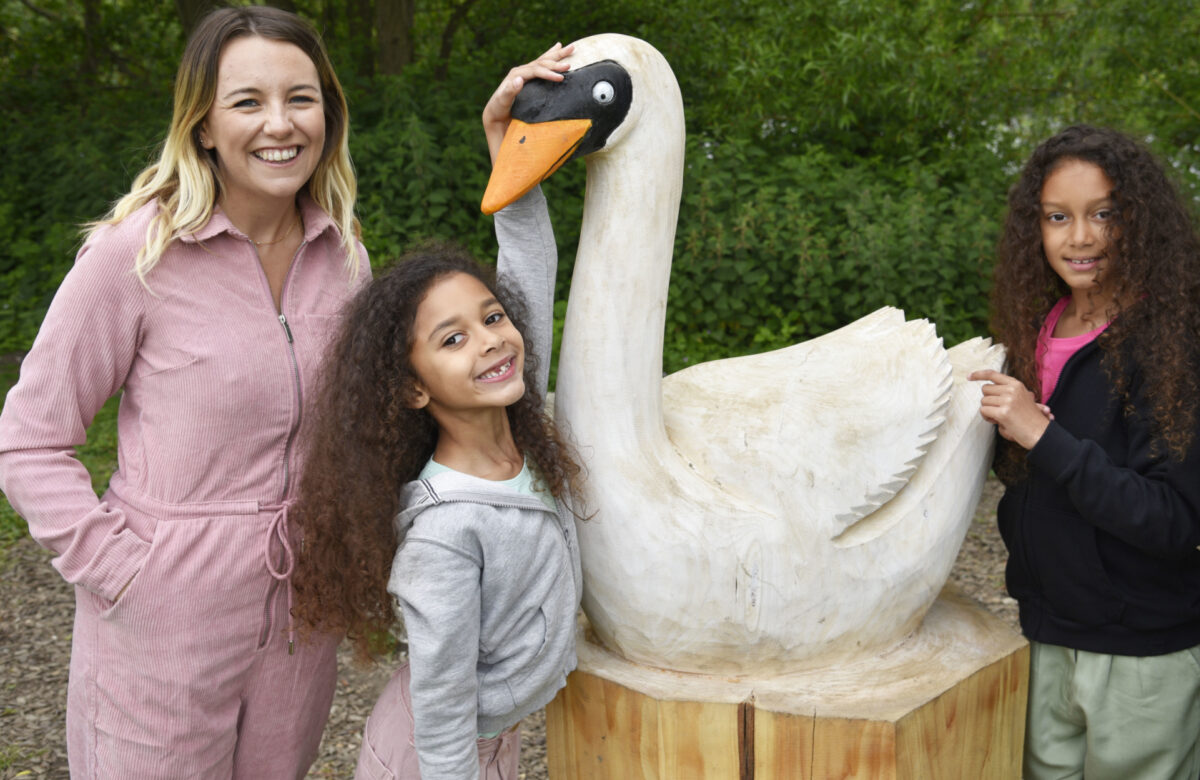 Woman and children with swan