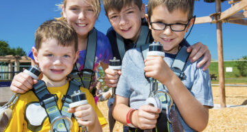 Young children in Sky Ropes harnesses