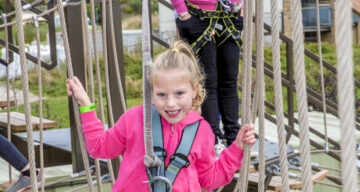 A girl and a lady using Sky Ropes