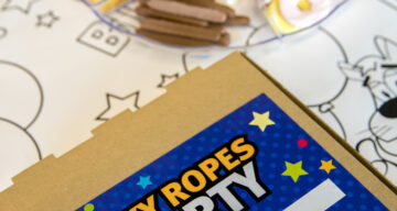 A Sky Ropes birthday party table setting