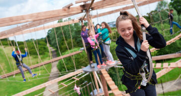 A group of people using the Sky Ropes apparatus