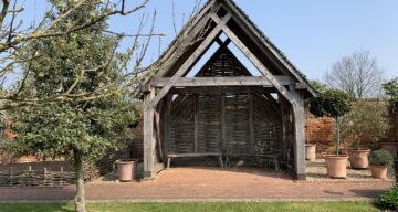A small wooden shelter with seating