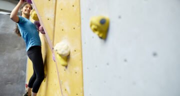 A lady on a climbing wall