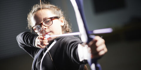 A girl doing archery