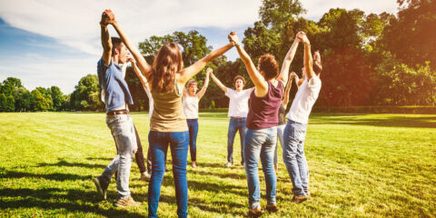 People holding hands in a circle