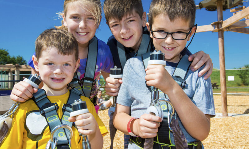 Young children in Sky Ropes harnesses