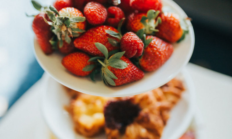 Fresh fruit and pastries on a cake stand